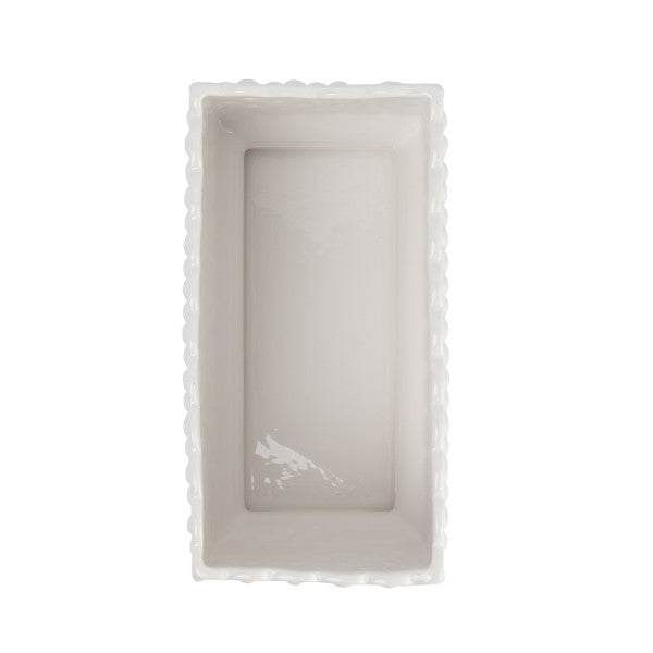 A white ceramic planter with a hobnail texture, scalloped edge, and polka dots.